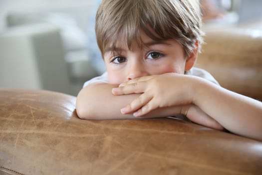 Portrait of cute little boy being thoughtful
