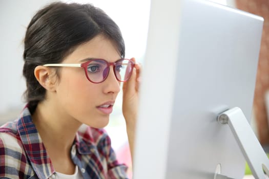 Portrait of office worker with eyeglasses on