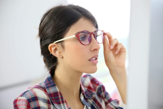 Portrait of office worker with eyeglasses on
