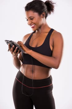 young black woman wearing fitness outfit on white isolated background