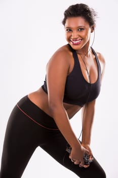 young black woman wearing fitness outfit on white isolated background