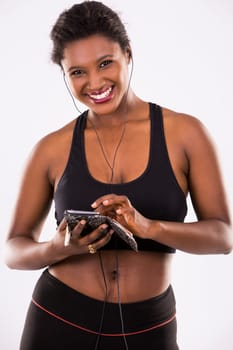 young black woman wearing fitness outfit on white isolated background
