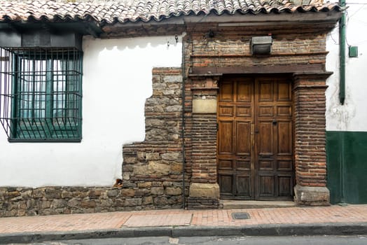 Historic white colonial building in La Candelaria neighborhood of Bogota, Colombia