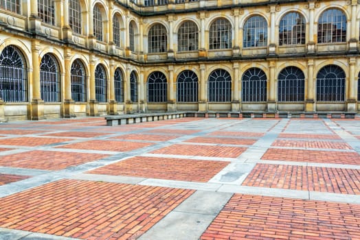 Historic building in the downtown of Bogota, Colombia with the ground in an interesting brick made pattern