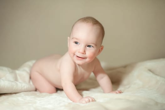 The little boy newborn baby smiling and drooling creeps and lies, Sleeps