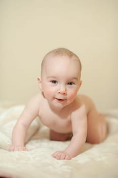 The little boy newborn baby smiling and drooling creeps and lies, Sleeps