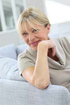 Portrait of senior woman relaxing in couch