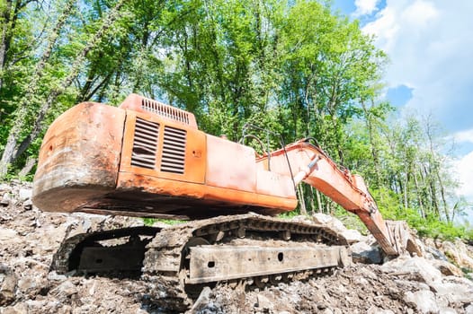 Excavator with big shovel to work with rocks