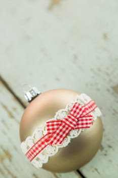 Decorated Christmas balls on a rustic wooden board at Christmas time with text free space