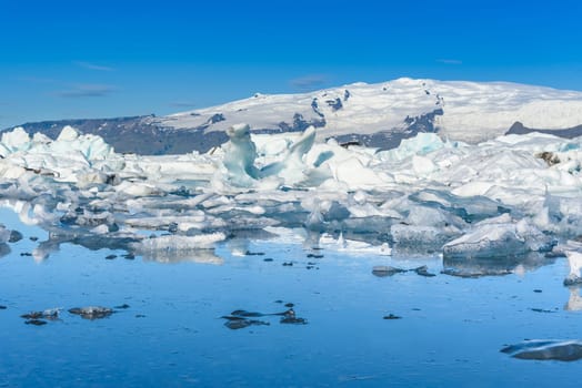 Beautiful view of icebergs in Jokulsarlon glacier lagoon, Iceland, selective focus, global warming and climate change concept