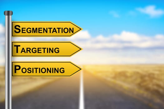 segmentation, targeting, positioning marketing strategy words on yellow road sign with blurred background
