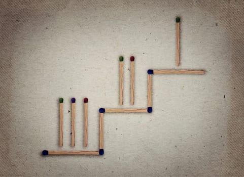 Set of matches stacked in a staircase or stairs formation as a metaphor for business career opportunities. Way to success. Competition and rivalry concept
