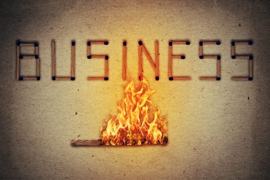 Burning match setting fire to its neighbors in arranged in shape of business word. Ignited match stick  as a symbol for business risks and dangers.
