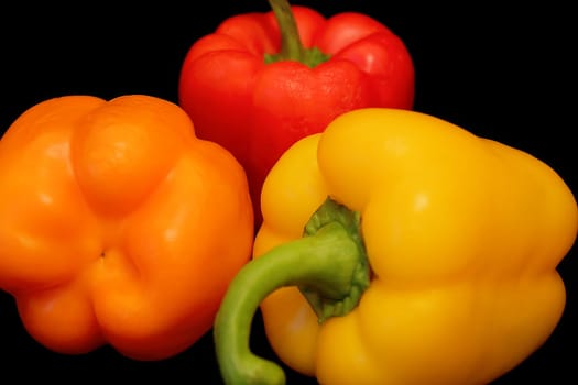Image of raw peppers on black background
