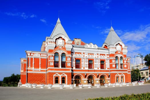 Town landscape with historic theater and blue sky
