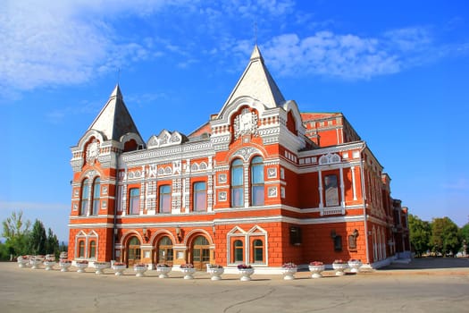 Town landscape with historic theater and blue sky
