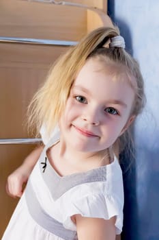 Portrait of cute girl with blond hair