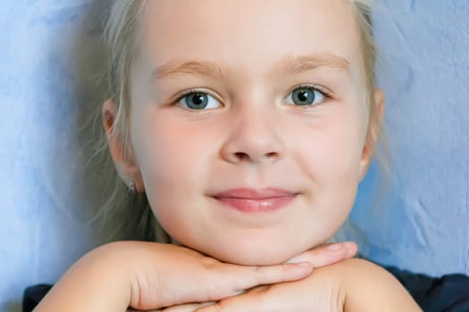 Portrait of cute girl with blond hair
