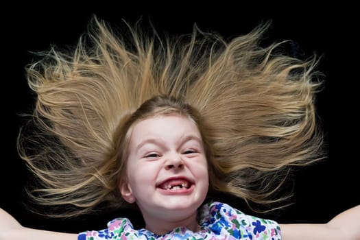 Cute beautiful girl makes faces imitate witch