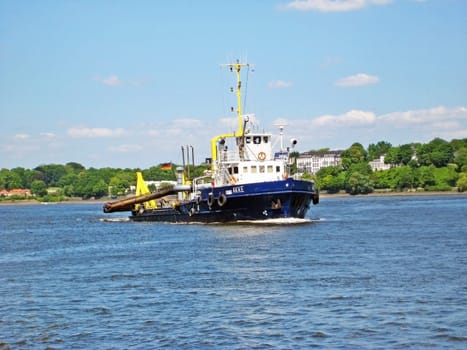 Hamburg, Germany - May 24, 2008: Construction vessel "Akke"" on the river Elbe. It eliminates slick and sediments in the docks."