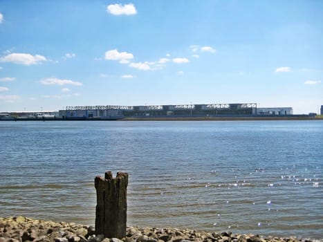 Hamburg, Germany - May 24, 2008: Industrial hall of Airbus, river Elbe in front.