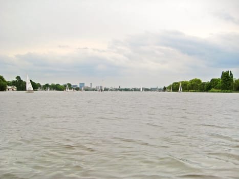 Hamburg, Germany - May 24, 2008: Hamburg Aussenalster river, with view of the skyline of Hamburg city
