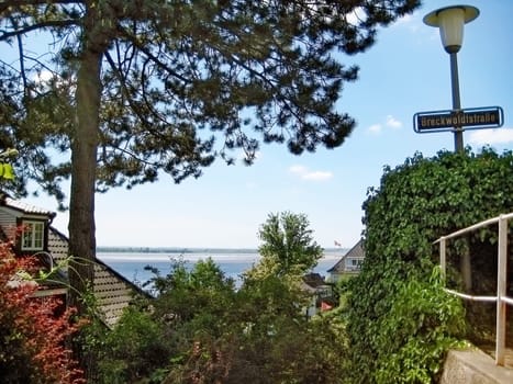 Hamburg, Germany - May 24, 2008: Hamburg district Blankenese, the exclusive residential area and suburb of the city. View between luxury houses in the hills towards river Elbe.