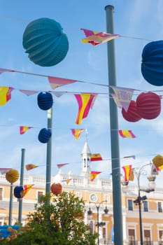 Badajoz Town Hall building between paper lanterns during San Juan Festivities Fair