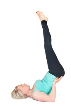 Full body view of a young blonde woman doing yoga exercises against a white background with a slight shadow