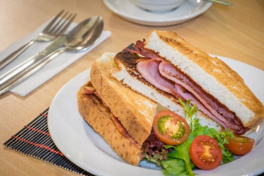 Toasted bread with bacon served for breakfast