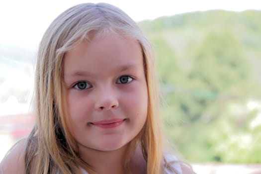 Portrait of beautiful girl with blue eyes