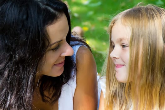 Mother and daughter looking to each others