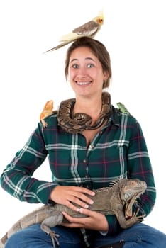 Girl with several pet animals isolated in white