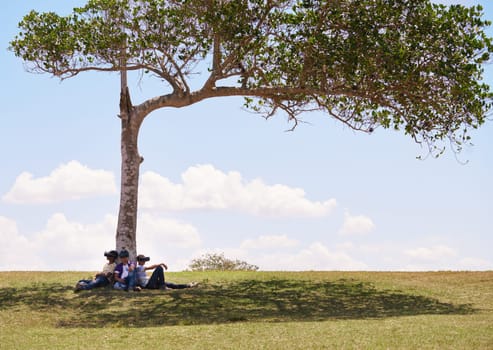 Youth culture, young people, group of male friends, multiethnic teens playing with VR outdoors, teenagers using virtual reality headset in park, boys and modern technology. Future 3D hi-tech