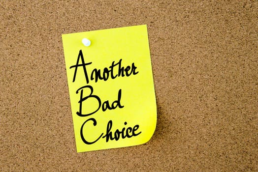 ABC Another Bad Choice written on yellow paper note pinned on cork board with white thumbtacks, copy space available