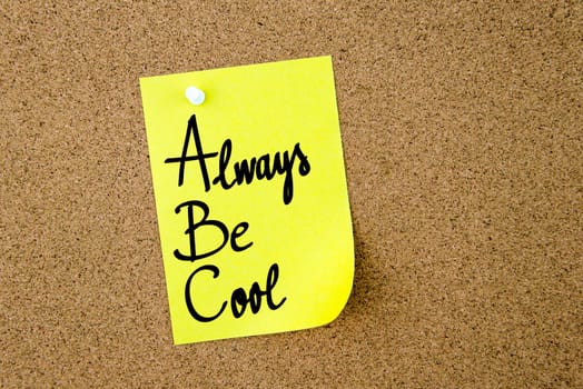 ABC Always Be Cool written on yellow paper note pinned on cork board with white thumbtacks, copy space available