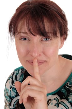 A smiling beautiful woman holding her finger over her mouth in closeup.isolated for white background..
