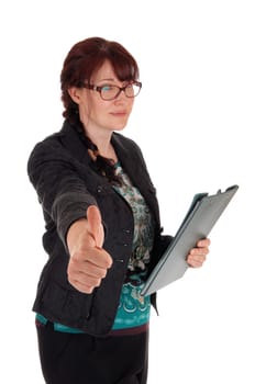 A Caucasian business woman standing with her clipboard in her hand and.showing her thump up, isolate for white background..