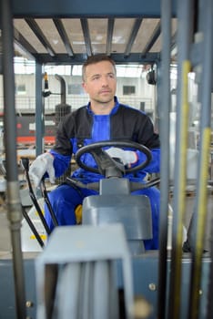 man driving a forklift