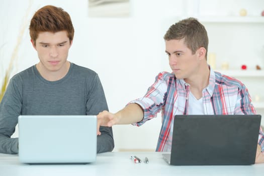 Two guys studying