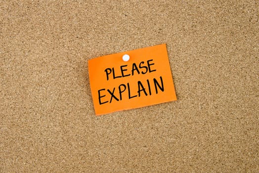 Please Explain written on orange paper note note pinned on cork board with white thumbtack, copy space available