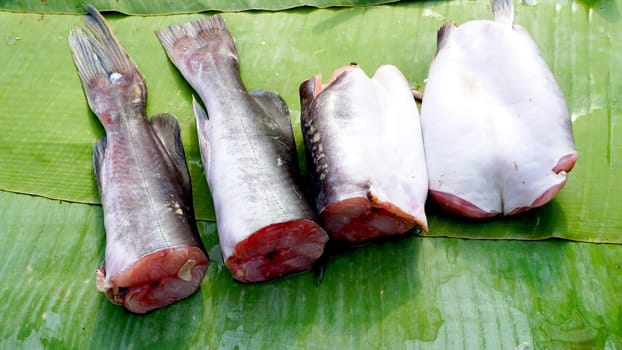 fish pieces on banana leaf in fresh market Luang Prabang, Laos