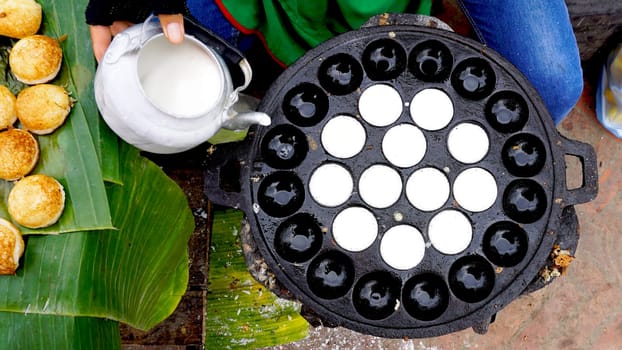 Process of cooking Sweet and Savory Grilled Coconut-Rice Hotcakes, Coconut Rice Cake on banana packaging, Asian dessert, Thai, Thailand, Luang Prabang, Laos