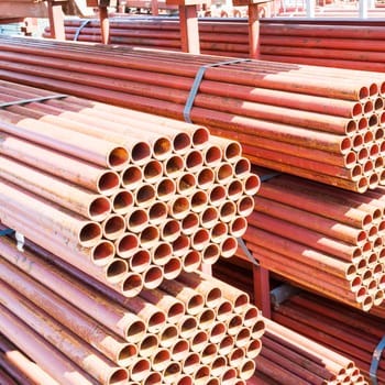 Steel Pipes bunch on the rack in warehouse