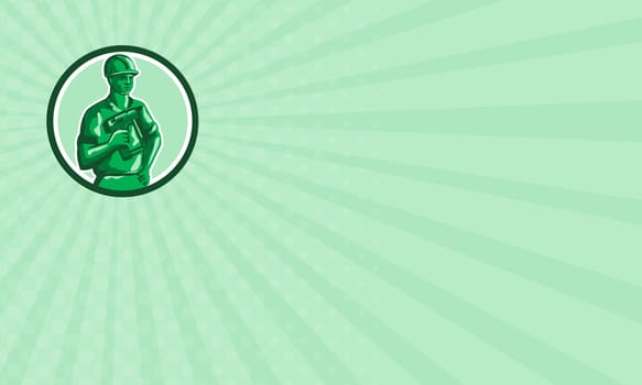 Business card showing illustration of a green plastic toy construction worker standing wearing hard hat holding nailgun and other hand on hips  set inside circle on isolated background done in retro style.
