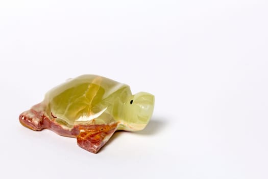 Turtle from onyx on a white background
