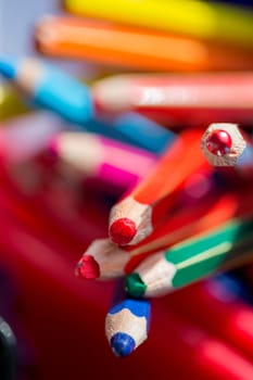 Close up of colouring pencils in a pot.