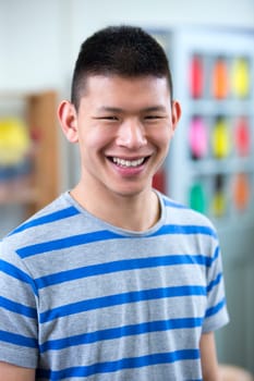 Portrait of a male school teacher in a classroom.