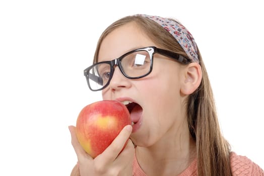 child girl eats a apple isolated on white background