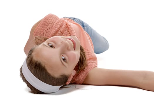 young girl lying on the floor isolate on white